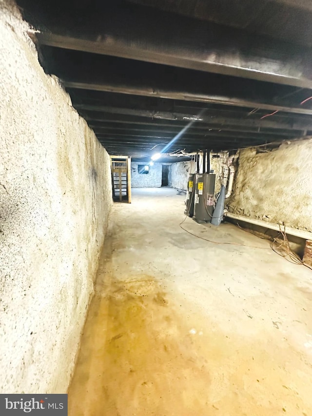 unfinished basement with electric water heater