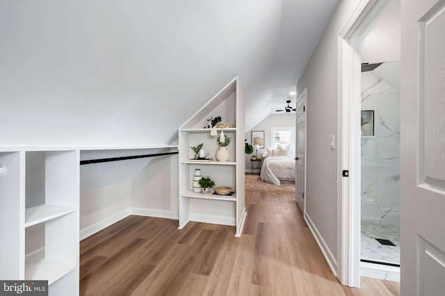1233 Kendrick Rd, Rosedale, MD 21237 - hallway with wood finished floors, vaulted ceiling, and baseboards