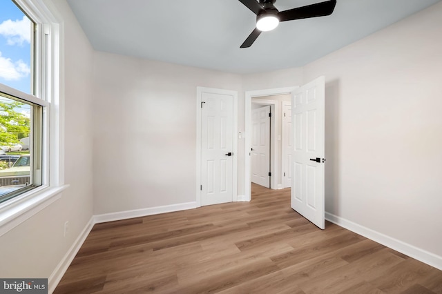 1233 Kendrick Rd, Rosedale, MD 21237 - unfurnished bedroom featuring light wood finished floors, baseboards, and a ceiling fan