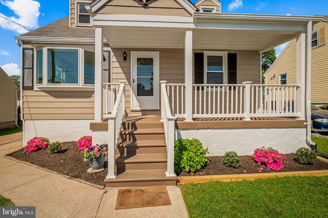 1233 Kendrick Rd, Rosedale, MD 21237 - view of front of house featuring covered porch and roof with shingles