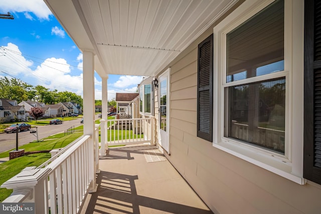 1233 Kendrick Rd, Rosedale, MD 21237 - balcony featuring covered porch and a residential view