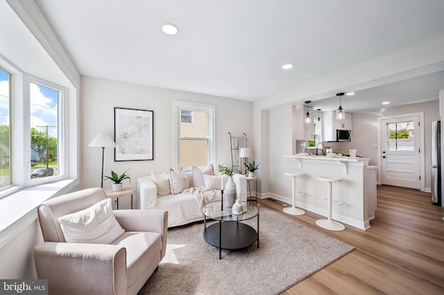 1233 Kendrick Rd, Rosedale, MD 21237 - living room featuring wood finished floors, recessed lighting, and baseboards