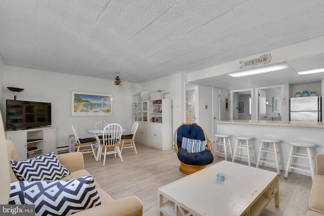 6 141st St Unit 304, Ocean City, MD 21842 - living room featuring wood finished floors and a textured ceiling