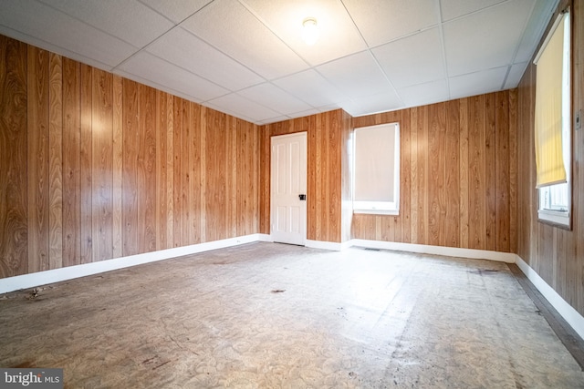 614 W Front St, Marietta, PA 17547 - empty room featuring baseboards, wooden walls, and a paneled ceiling