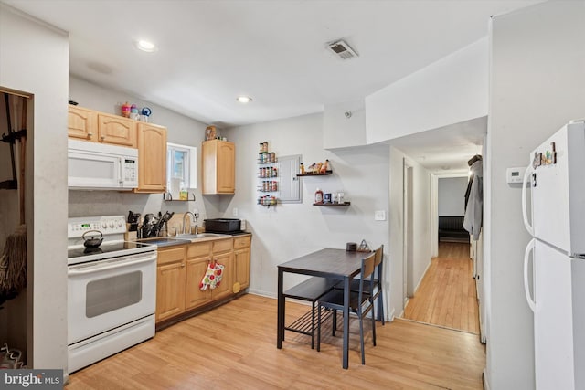 2059 W Oxford St, Philadelphia, PA 19121 - kitchen with white appliances, light brown cabinetry, light wood-style flooring, a sink, and recessed lighting