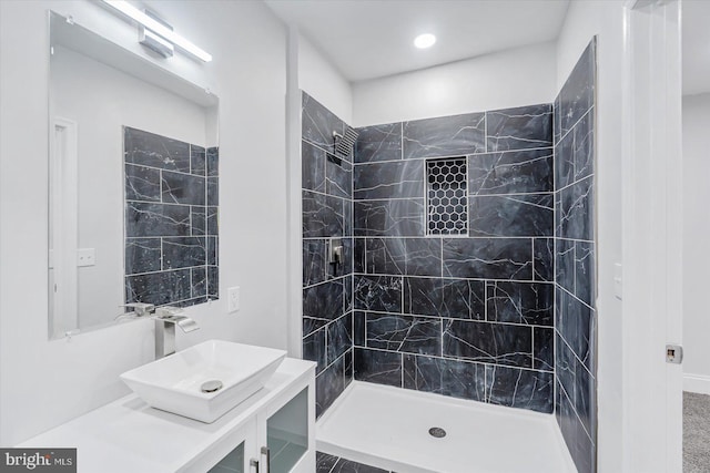 full bathroom featuring a stall shower, vanity, and recessed lighting
