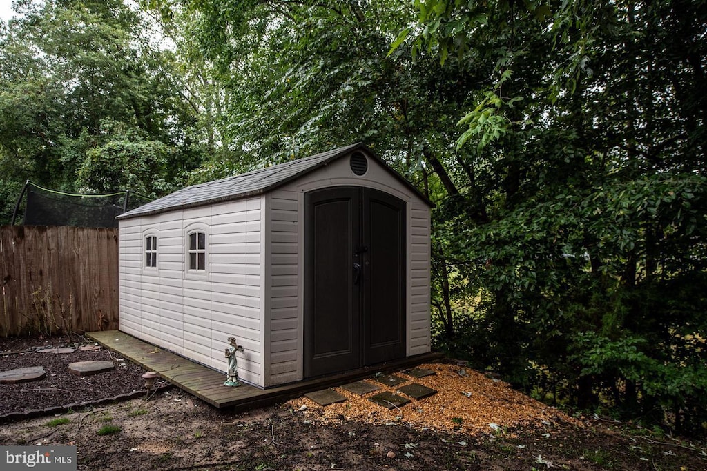 view of shed with fence