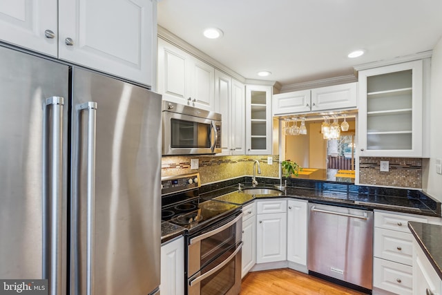 1211 Hesselius Ct, Annapolis, MD 21403 - kitchen with stainless steel appliances, a sink, white cabinetry, glass insert cabinets, and recessed lighting