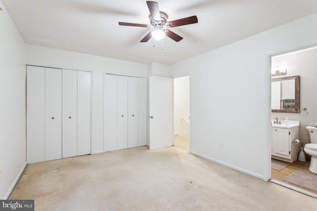 1211 Hesselius Ct, Annapolis, MD 21403 - unfurnished bedroom featuring multiple closets, light colored carpet, ensuite bath, and baseboards