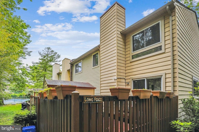 1211 Hesselius Ct, Annapolis, MD 21403 - rear view of house with a chimney