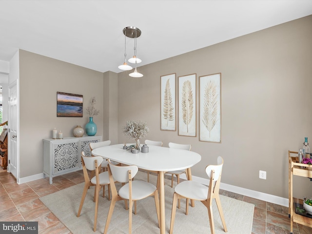 206 Village Center Blvd, Milton, DE 19968 - dining space featuring baseboards and light stone finish flooring