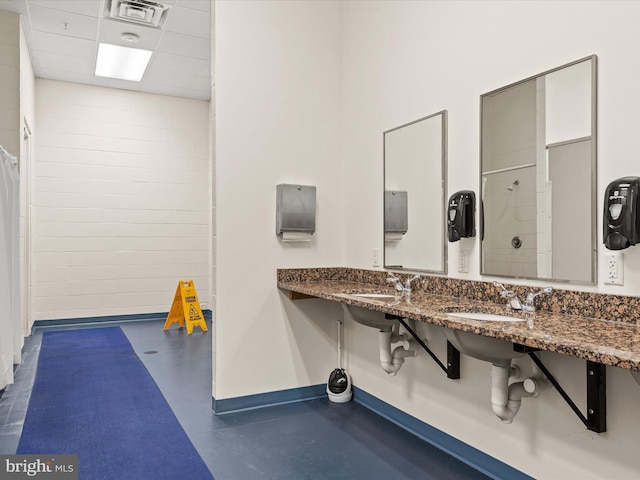 206 Village Center Blvd, Milton, DE 19968 - bathroom featuring baseboards, a shower with curtain, and a sink