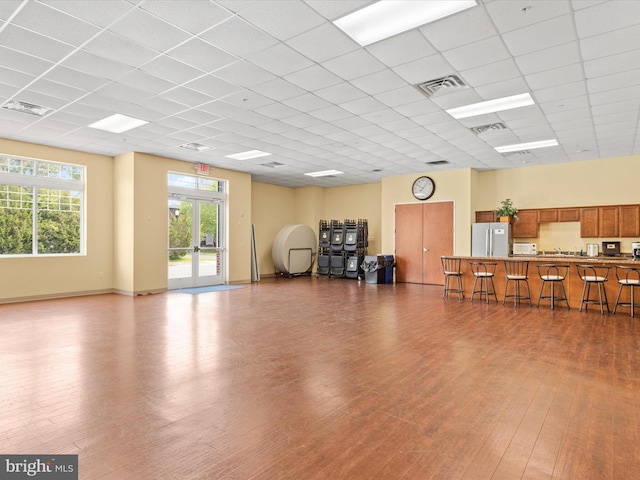 206 Village Center Blvd, Milton, DE 19968 - miscellaneous room featuring wood finished floors, a paneled ceiling, and baseboards