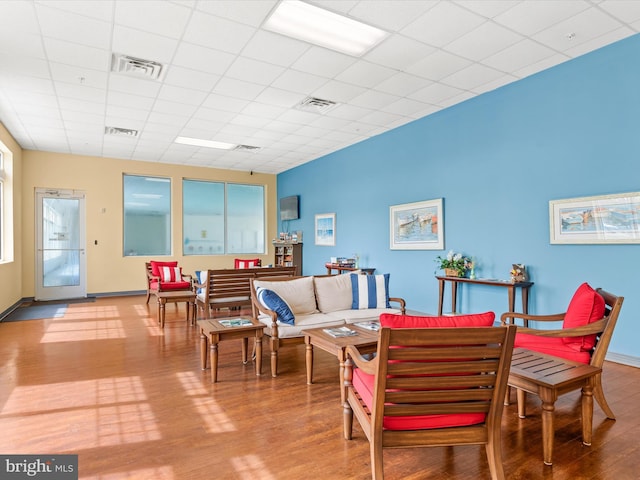 206 Village Center Blvd, Milton, DE 19968 - living area featuring wood finished floors, a paneled ceiling, and baseboards
