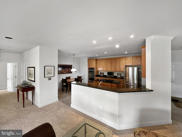 kitchen with dark countertops, stainless steel appliances, baseboards, light carpet, and recessed lighting