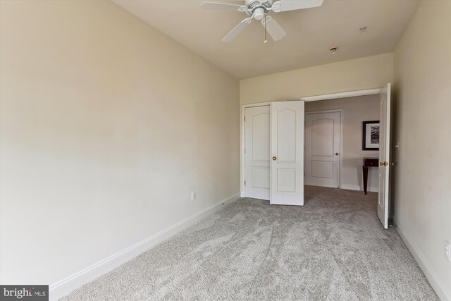 6000 Same Voyage Way Unit 307, Clarksville, MD 21029 - unfurnished bedroom featuring light colored carpet, baseboards, and ceiling fan