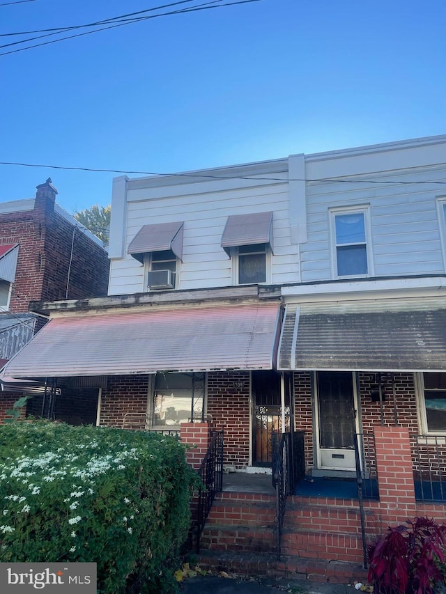 view of front of home with brick siding