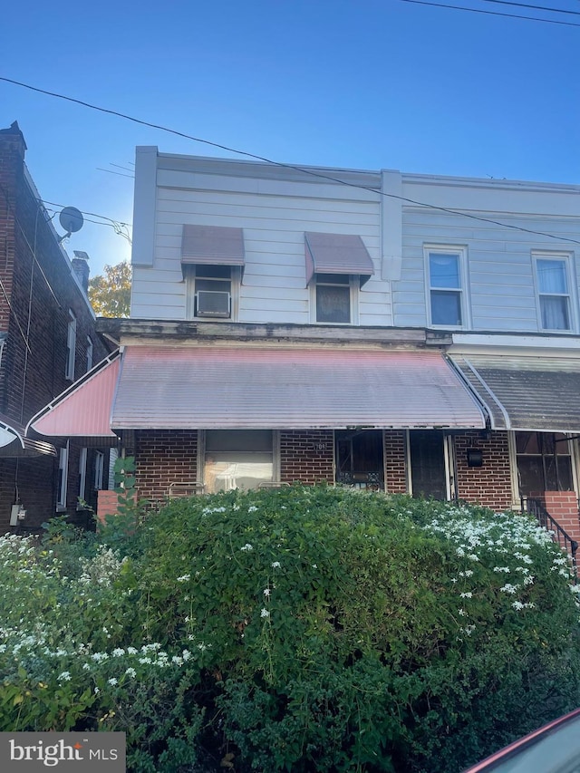 view of front of home with brick siding