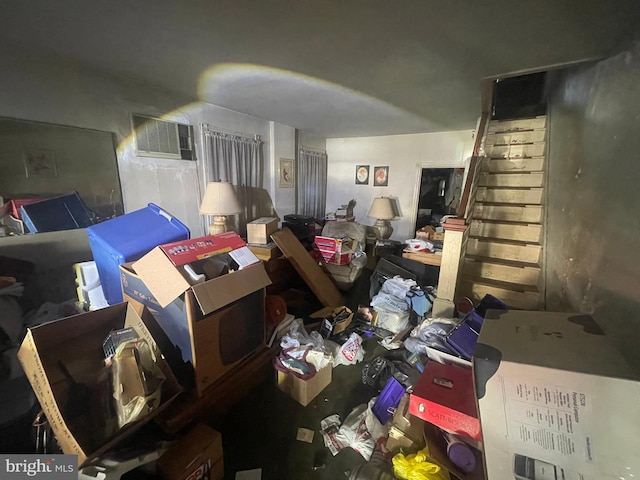 miscellaneous room featuring stairs and a wall mounted AC