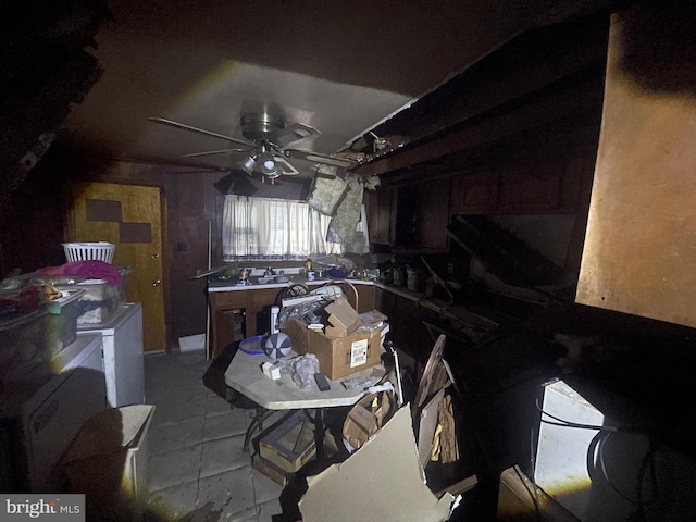 interior space with ceiling fan