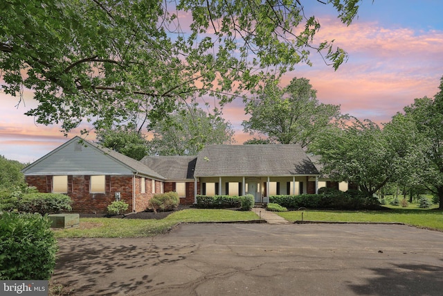 237 Bordentown-Georgetown Rd, Chesterfield, NJ 08515 - ranch-style house featuring brick siding, covered porch, a front yard, and roof with shingles