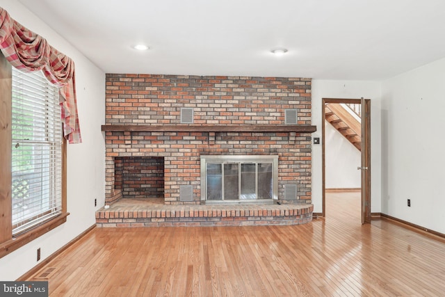 237 Bordentown-Georgetown Rd, Chesterfield, NJ 08515 - unfurnished living room with a fireplace, wood-type flooring, and baseboards
