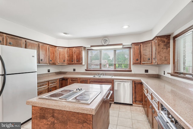 237 Bordentown-Georgetown Rd, Chesterfield, NJ 08515 - kitchen with appliances with stainless steel finishes, brown cabinetry, light tile patterned floors, light countertops, and a sink