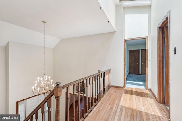 237 Bordentown-Georgetown Rd, Chesterfield, NJ 08515 - hallway with a chandelier, an upstairs landing, hardwood / wood-style flooring, baseboards, and lofted ceiling