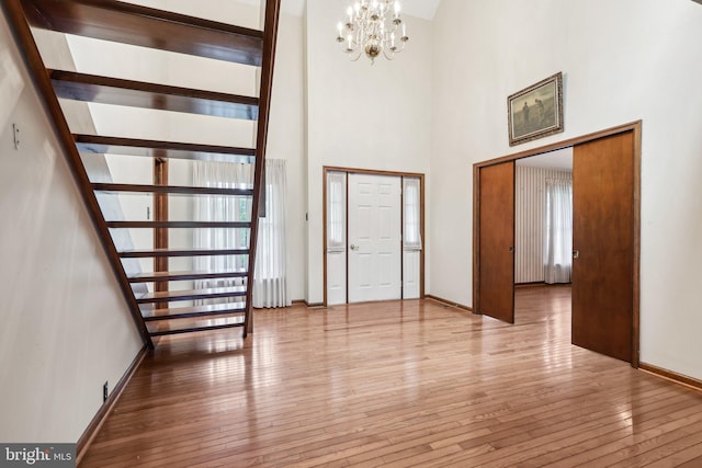 237 Bordentown-Georgetown Rd, Chesterfield, NJ 08515 - foyer entrance featuring a chandelier, hardwood / wood-style flooring, a towering ceiling, and baseboards