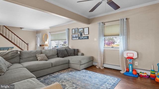 10 Queen Lily Rd, Levittown, PA 19057 - living area featuring wood finished floors, healthy amount of natural light, a ceiling fan, ornamental molding, and stairs