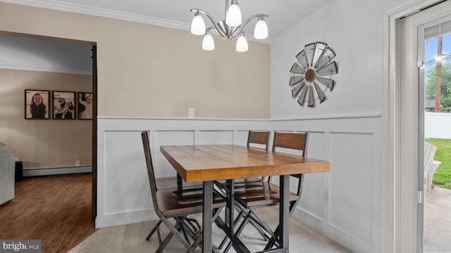 10 Queen Lily Rd, Levittown, PA 19057 - dining area featuring a baseboard heating unit, crown molding, a chandelier, and light wood-style floors