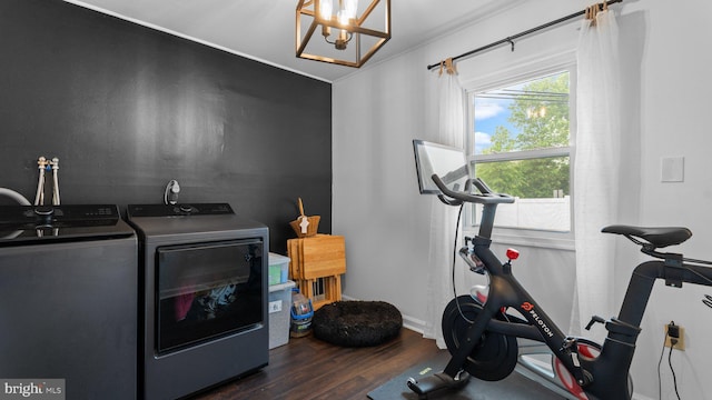 10 Queen Lily Rd, Levittown, PA 19057 - workout area with washer and dryer, dark wood-style flooring, a chandelier, and baseboards