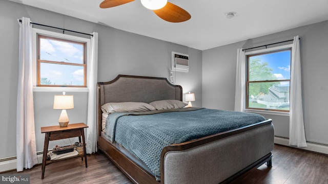 10 Queen Lily Rd, Levittown, PA 19057 - bedroom with wood finished floors, a wall unit AC, a baseboard radiator, and ceiling fan