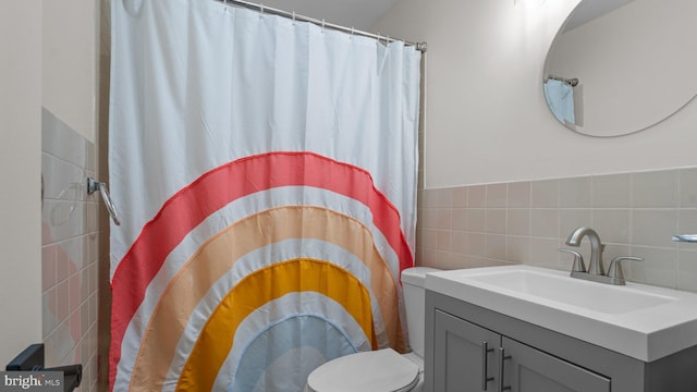10 Queen Lily Rd, Levittown, PA 19057 - bathroom with tile walls, toilet, a shower with shower curtain, and vanity