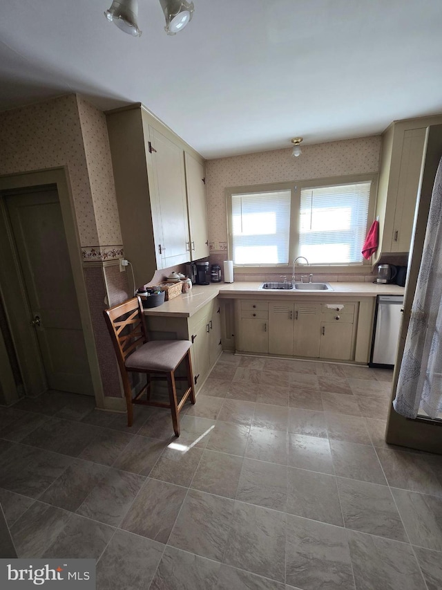 3880 Laurel Grove Rd, Federalsburg, MD 21632 - kitchen featuring a sink, wallpapered walls, dishwasher, and light countertops