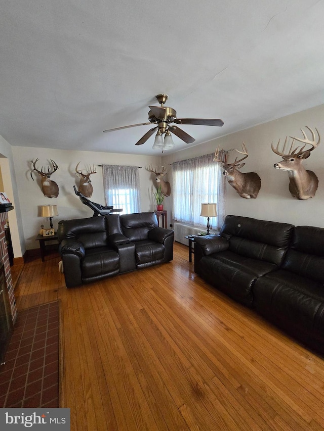 3880 Laurel Grove Rd, Federalsburg, MD 21632 - living area with radiator heating unit, hardwood / wood-style flooring, and ceiling fan