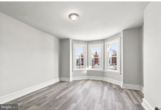 5410 Webster St, Philadelphia, PA 19143 - spare room featuring baseboards and wood finished floors