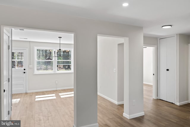5004 Barnaby Ln, Oxon Hill, MD 20745 - interior space featuring an inviting chandelier, light wood-style flooring, baseboards, and visible vents