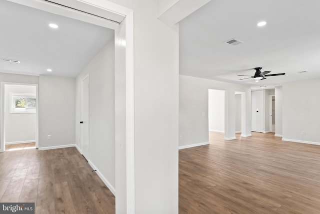 5004 Barnaby Ln, Oxon Hill, MD 20745 - hall featuring light wood finished floors, baseboards, visible vents, and recessed lighting