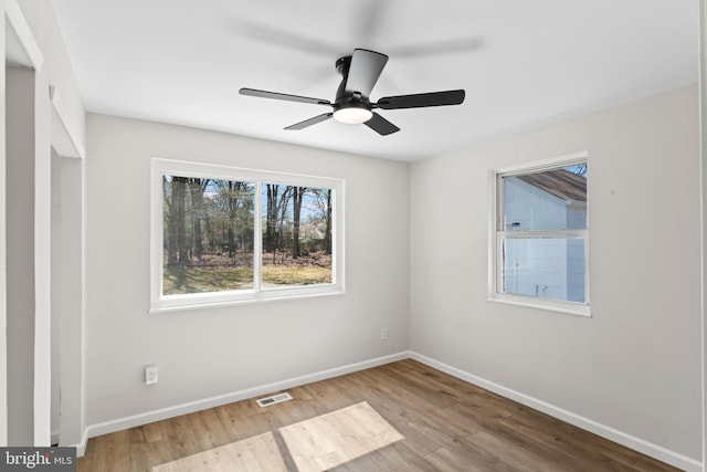 5004 Barnaby Ln, Oxon Hill, MD 20745 - empty room featuring baseboards, a ceiling fan, visible vents, and wood finished floors