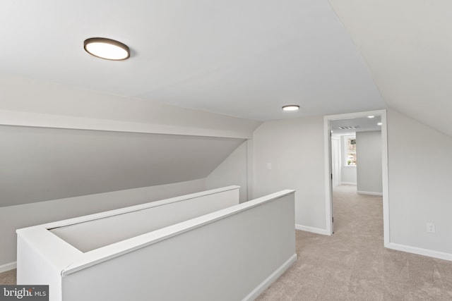 5004 Barnaby Ln, Oxon Hill, MD 20745 - corridor featuring baseboards, an upstairs landing, light colored carpet, and vaulted ceiling