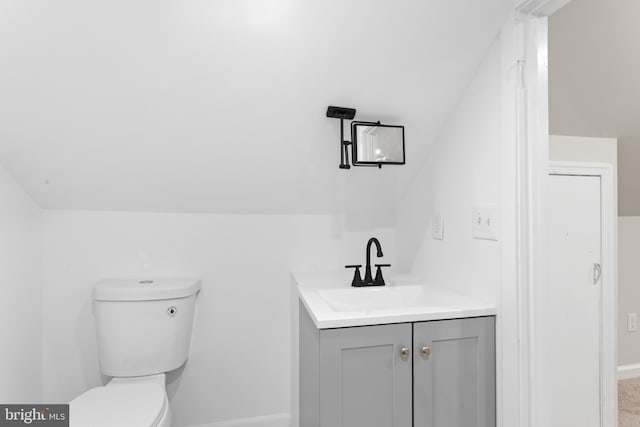 5004 Barnaby Ln, Oxon Hill, MD 20745 - bathroom featuring toilet, baseboards, and vanity