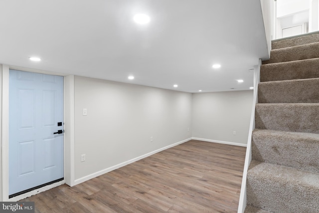 5004 Barnaby Ln, Oxon Hill, MD 20745 - below grade area featuring stairway, wood finished floors, baseboards, and recessed lighting