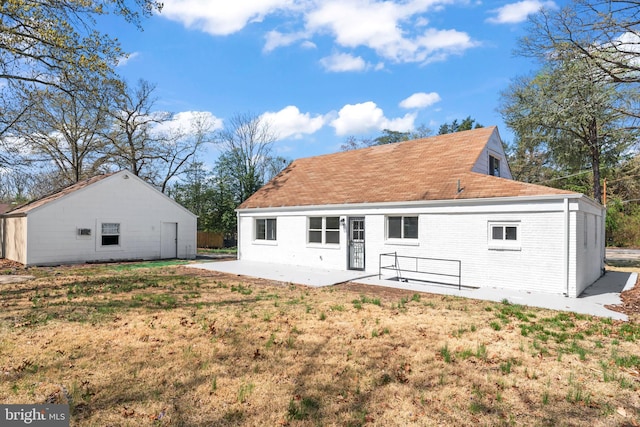 5004 Barnaby Ln, Oxon Hill, MD 20745 - rear view of house with a yard, a patio, and brick siding