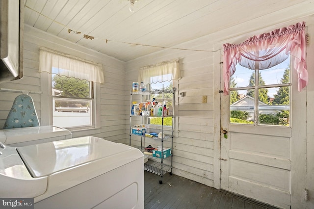 135 Pine St, Dover, DE 19901 - laundry room with washing machine and clothes dryer, dark wood finished floors, plenty of natural light, wooden walls, and wood ceiling