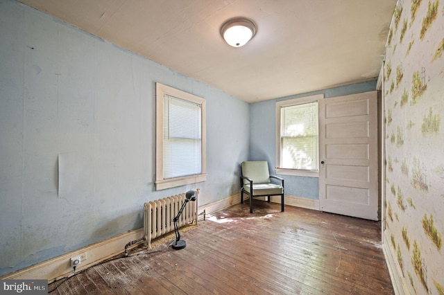 135 Pine St, Dover, DE 19901 - living area with radiator heating unit and wood-type flooring