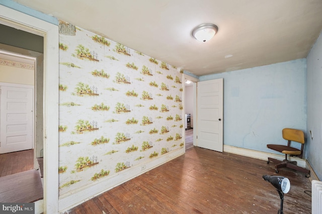 135 Pine St, Dover, DE 19901 - spare room featuring baseboards, hardwood / wood-style floors, and wallpapered walls