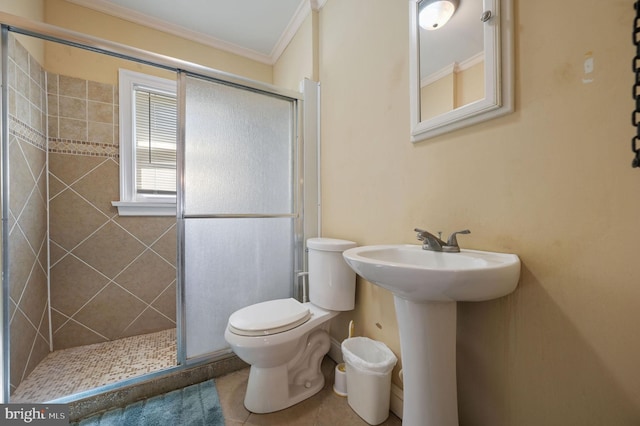 135 Pine St, Dover, DE 19901 - full bathroom with a stall shower, ornamental molding, toilet, tile patterned flooring, and a sink
