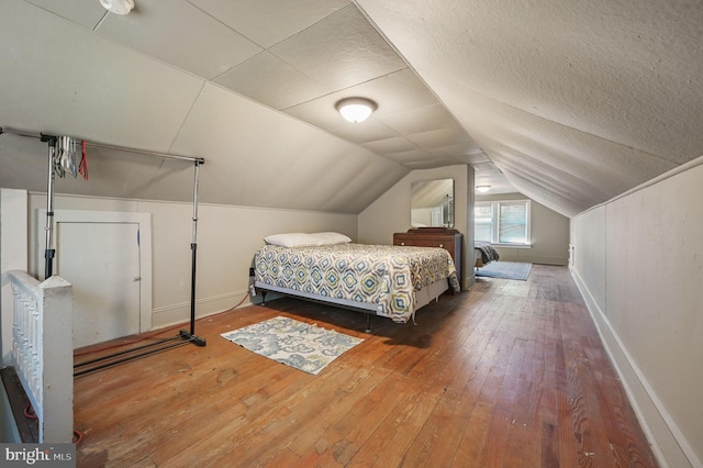 135 Pine St, Dover, DE 19901 - bedroom featuring baseboards, hardwood / wood-style floors, and vaulted ceiling