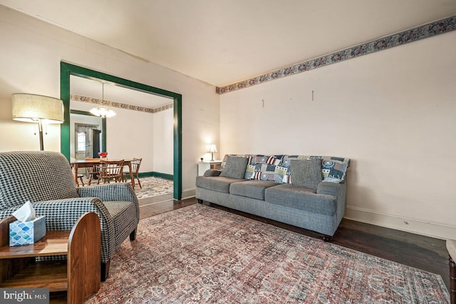 135 Pine St, Dover, DE 19901 - living room with wood finished floors, baseboards, and a chandelier